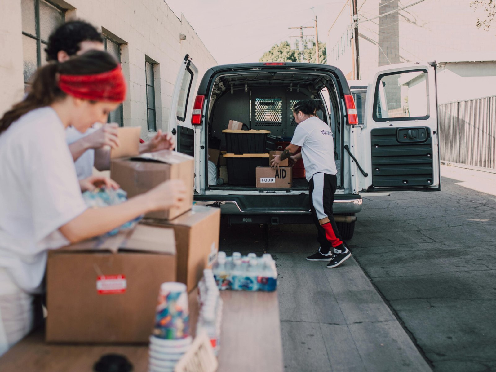 people arranging logistics packages for shipment