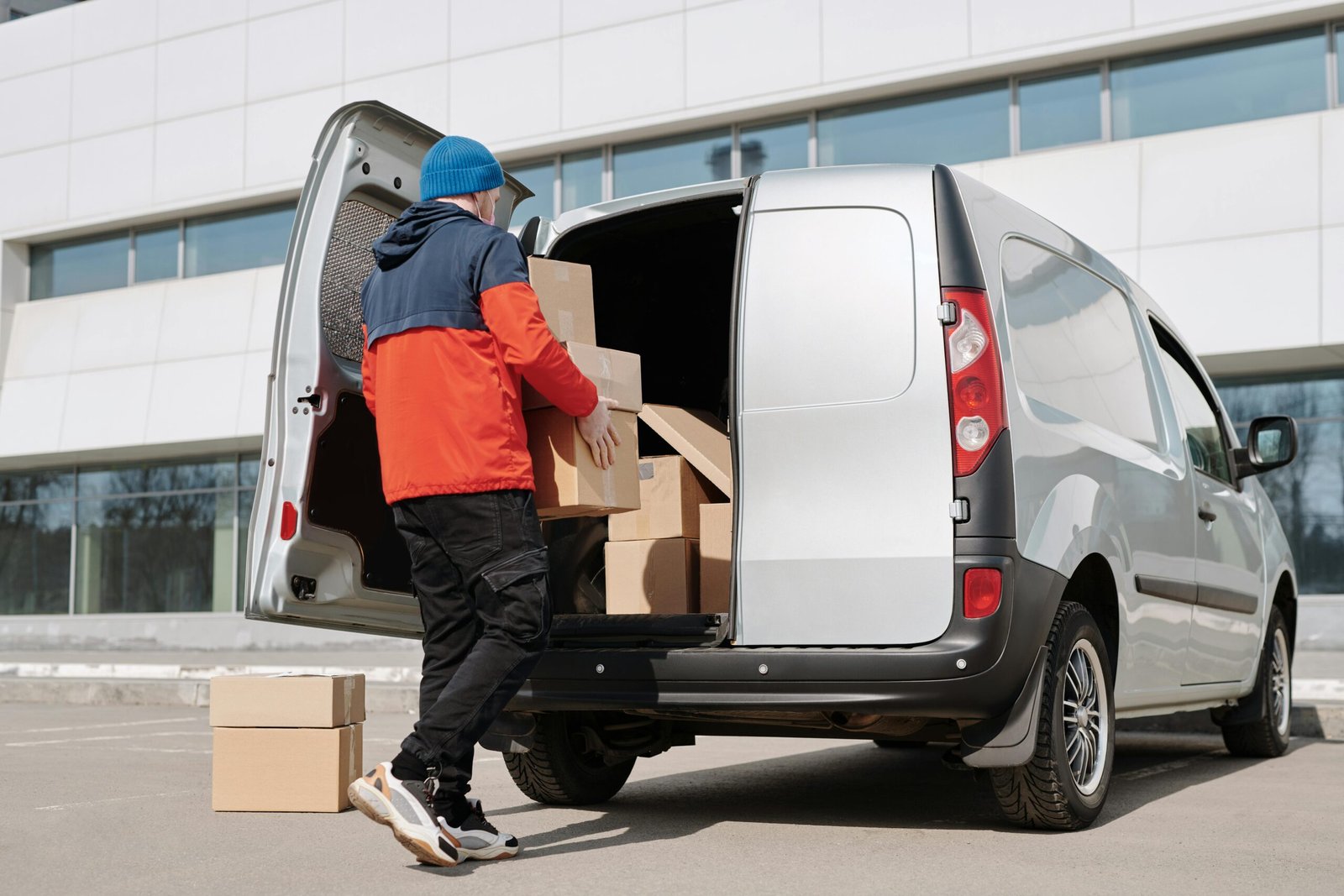 Man loading a box truck outside yard