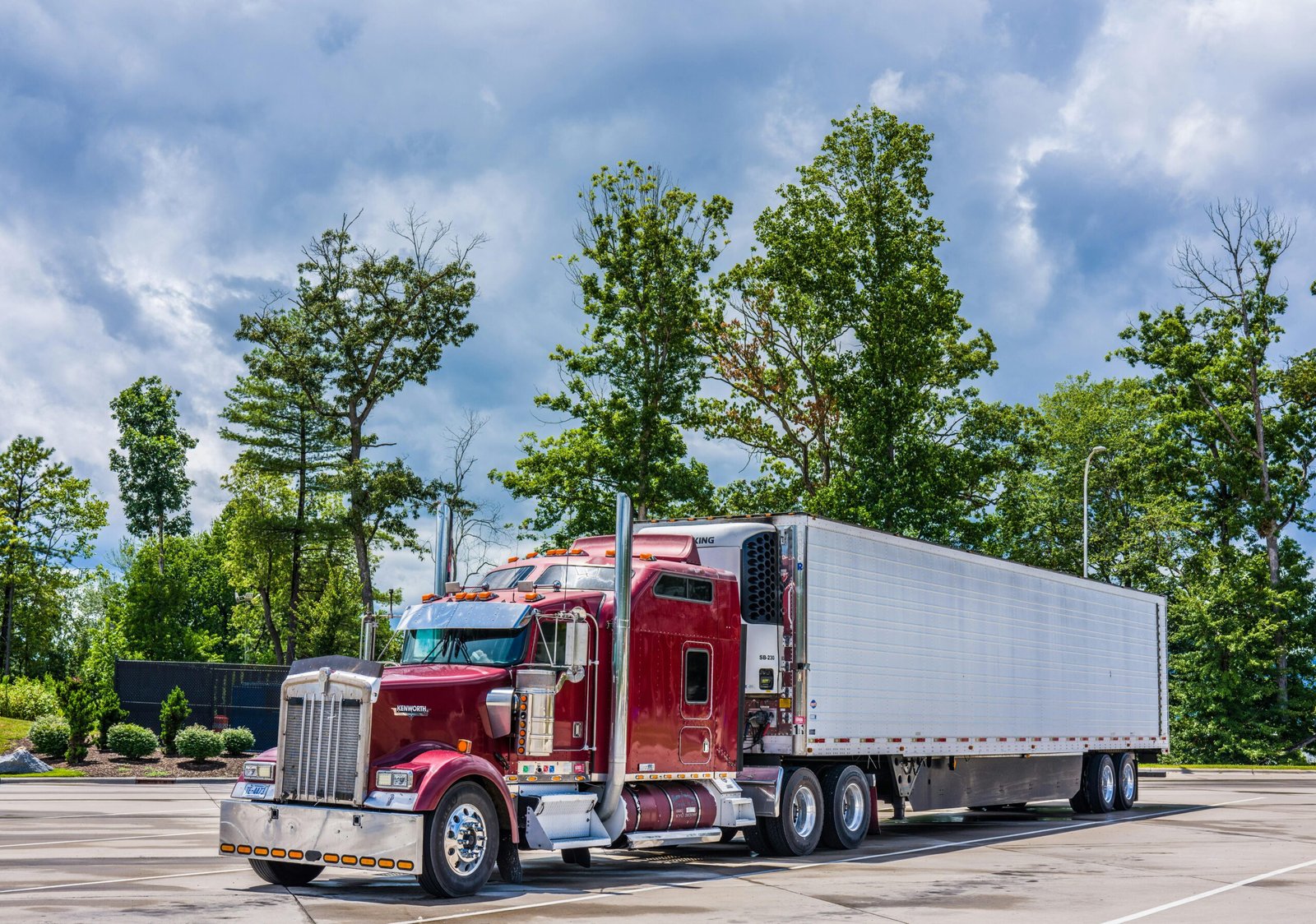 Semi truck parked out on a field 